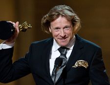 Mantle picks up the Oscar <em>Photograph: Michael Yada / ©A.M.P.A.S.</em>
