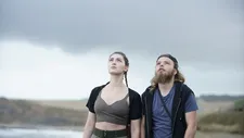 Jane (Anamaria Vartolomei) with Rudy (Julien Manier) looking up at the sky
