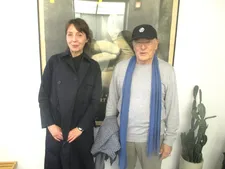 Volker Schlöndorff with Anne-Katrin Titze holding up  I Planted Trees by Richard St. Barbe Baker