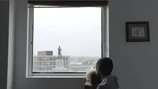 CJ Hunt staring at the Robert E Lee statue in New Orleans