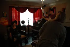 The crew prepares to film Annie Potts
