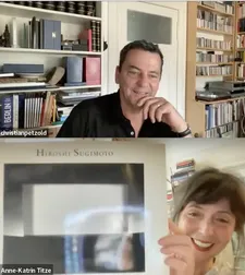 Christian Petzold with Anne-Katrin Titze holding up a Hiroshi Sugimoto photography book, collection Ed Bahlman