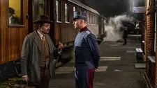 Dr. Faber (David Dencik) with Anton (Esben Smed) at the train station in Copenhagen