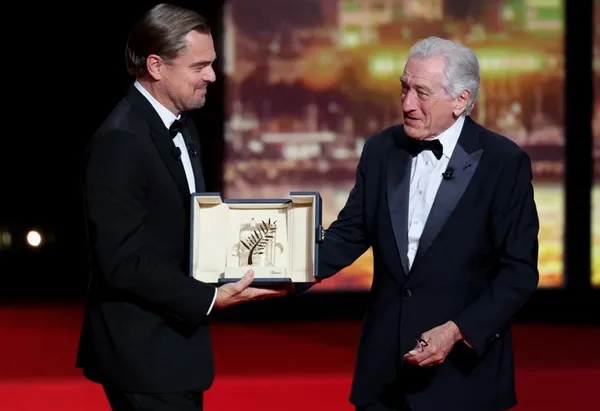 Leonardo DiCaprio presents Robert De Niro with his honorary Palme d’Or