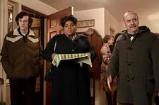 Angus (Dominic Sessa) with Mary Lamb (Da'Vine Joy Randolph) and his teacher Mr. Hunham (Paul Giamatti) at Miss Crane’s Christmas Eve party