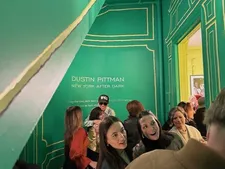 Dustin Pittman giving a hug at the opening reception for New York After Dark
