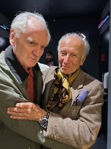 Ron Delsener gives a hug to Ed Bahlman at the Quad Cinema in New York