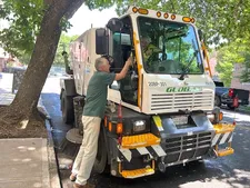Ed Bahlman thanks sanitation worker Kevin Gonzalez after offering him a bottle of cold water on the hottest June 24th recorded in NYC history