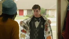 Egghead (Louis Tomeo) shows off his 'snacket' – a genius new way to sneak candy and Cheetos into the movie theatre.