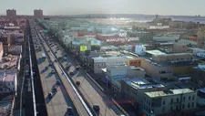 Aerial view of Sunset Park’s waterfront with graphic overlay highlighting zoning