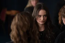 Sarah is alone in a crowd