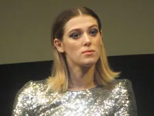Honor Swinton Byrne on an outfit she wears in The Souvenir: "Under the grey suit and the amazing dress is a corset, that I had to get [she makes a sound] sucked into."