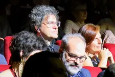 Face in the crowd at a Festival screening: Mark Cousins, centre, will present the final chapter in his history of cinema at the Cannes Film Festival