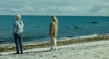 Alex (Joseph Longo) with his mother Bettina (Barbara Sukowa) on the beach in We're Not Done Yet