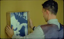 Joseph Marti (Piotr Trojan) inspects a painting of The Smiths’ album cover by Wilhelm Sasnal