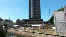 Crowds gather in the shadow of Hotel Thermal