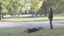 Liam Gillick as H on his belly in the grass with Viv Albertine as D: "When he felt he was part of a counterculture, even if it's an elitist one."