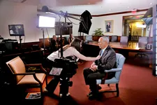 Lisa Hurwitz straightens Colin Powell’s tie in The Automat