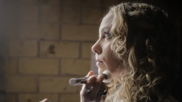 Kelsey Pribilski getting her make-up done on the set of Man Finds Tape