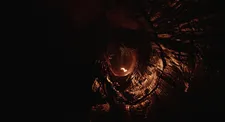 Magazine page set on fire by a speleologist in Il Buco to light the cave