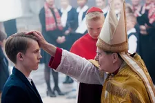Cardinal Barbarin (François Marthouret) with Alexandre and Marie’s son Gauthier (Max Libert)