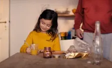 Mia Kasalo as Clara, making her grocery list: "So the grocery shopping list gets to be a character."