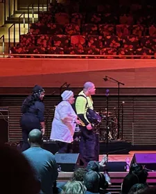 ESG singer/songwriter Renee Scroggins walks on stage with her children Nicholas Nicholas and Nicole Nicholas