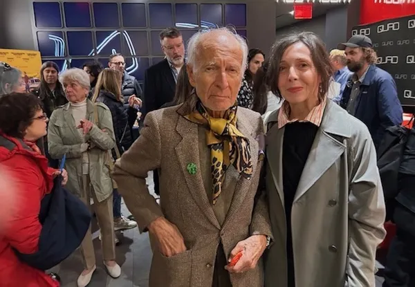 Jake Sumner’s Ron Delsener Presents star, wearing a 99 Elvis Costello Armed Funk Tour badge from 1979 (presented to him by music producer/99 Records founder Ed Bahlman) with Anne-Katrin Titze at the Quad Cinema