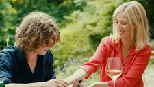 Théo (Samuel Kircher) giving Anne (Léa Drucker) a three-dot tattoo