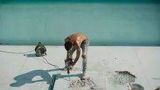 Rahim (Ibrahim Keshk) works on the pool