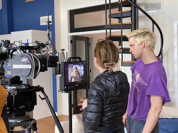 Joseph Longo with Sofia Camargo on the We’re Not Done Yet set watching Barbara Sukowa’s performance on the monitor