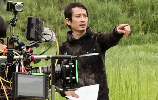 In action on a film set: Trần Anh Hùng, director of The Taste Of Things: 'I always tell the actors to savour the lines before saying them because that makes the spectators really want to hear what they are about to say. French cinema can be very talkative but we need time to understand the words and that’s why I like long takes.'