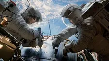 Sandra Bullock as Dr Ryan Stone and George Clooney as Matt Kowalsky in Alfonso Curaon's Gravity