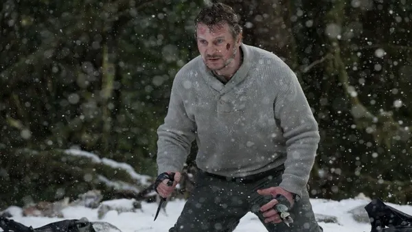 Liam Neeson faces off against a pack of wolves in The Grey