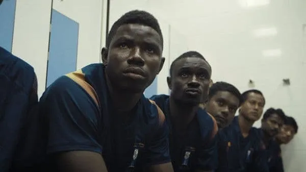 The team in the changing room before a big match. Left to right: Kenneth, David, Binumon, Purna, Umesh, Padam. Adam Sobel: 'It was an escape for everybody. A psychological escape and a literal escape from the camp and the daily routine'